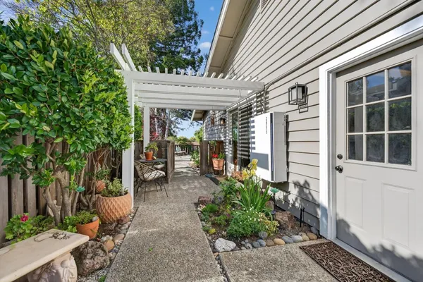 an aerial view of a house with garden space and street view