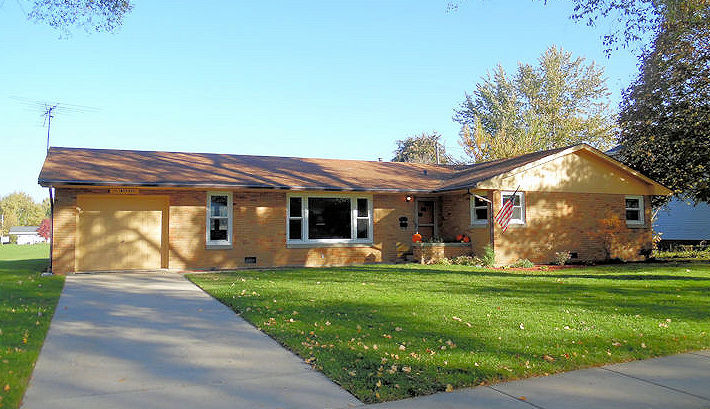 a view of a house with garden and yard