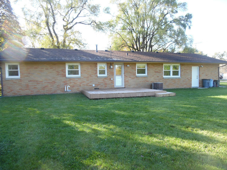 1111 10th Avenue Rochelle, IL 61068 - Photo 15 of 17 a front view of house with yard and green space