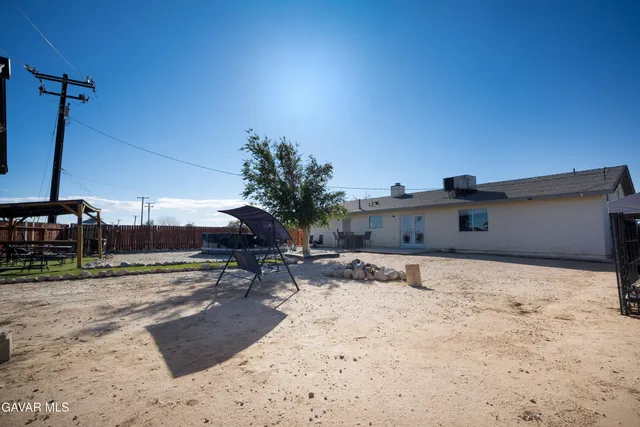 a view of a backyard of the house