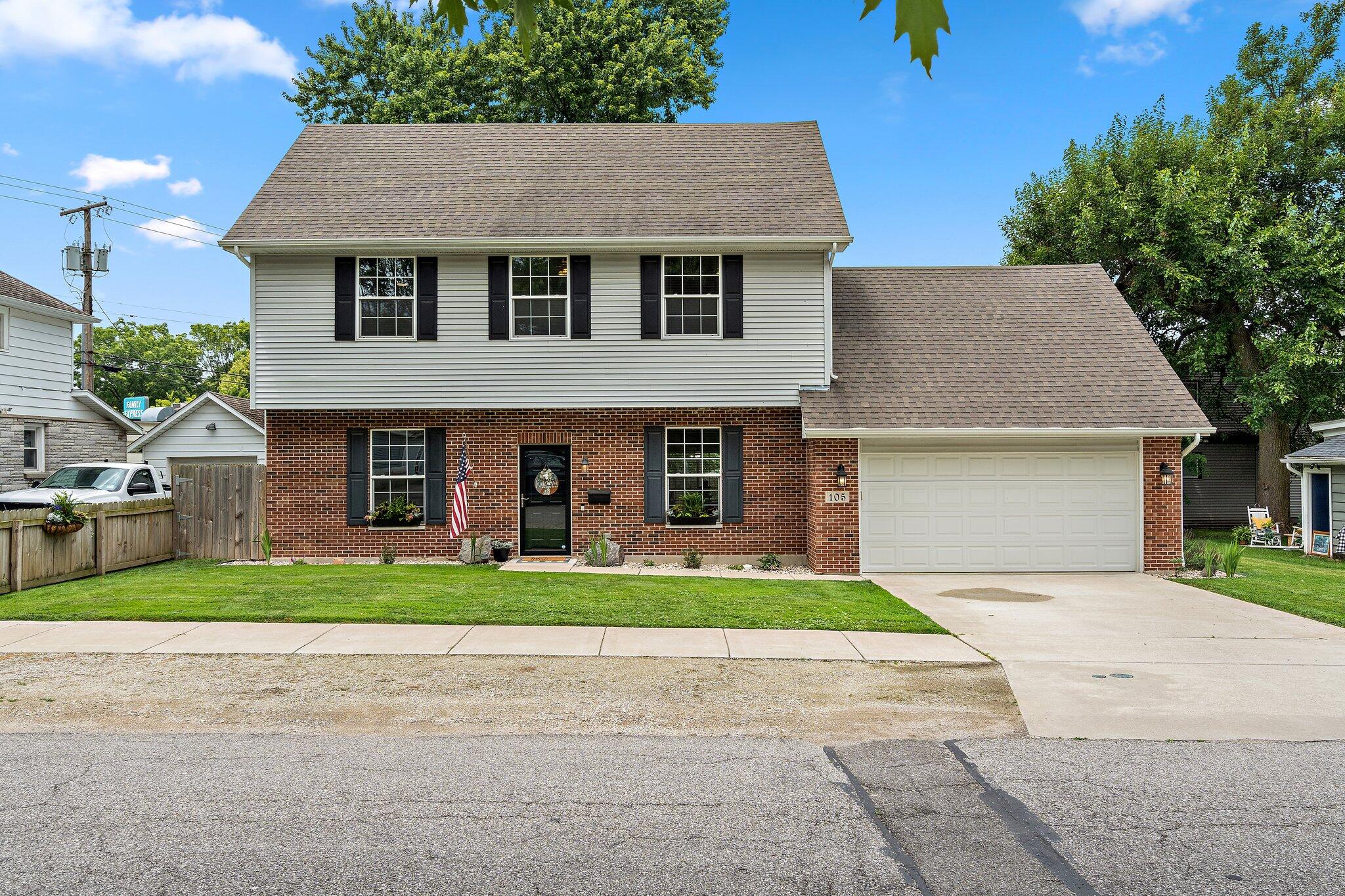 105 Madison Street Valparaiso, IN 46385 - Photo 1 of 29 a front view of a house with a yard and garage