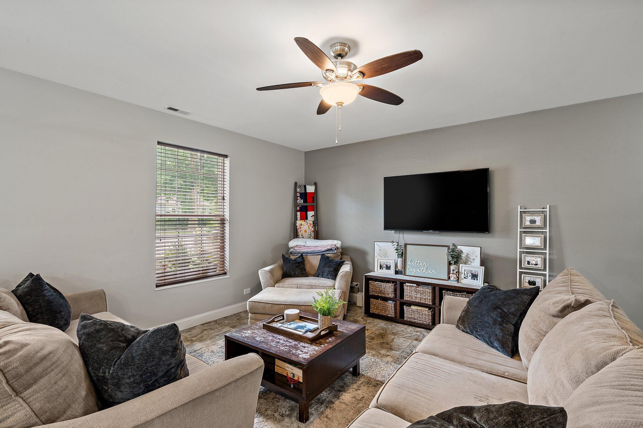 105 Madison Street Valparaiso, IN 46385 - Photo 11 of 29 a living room with furniture and a flat screen tv