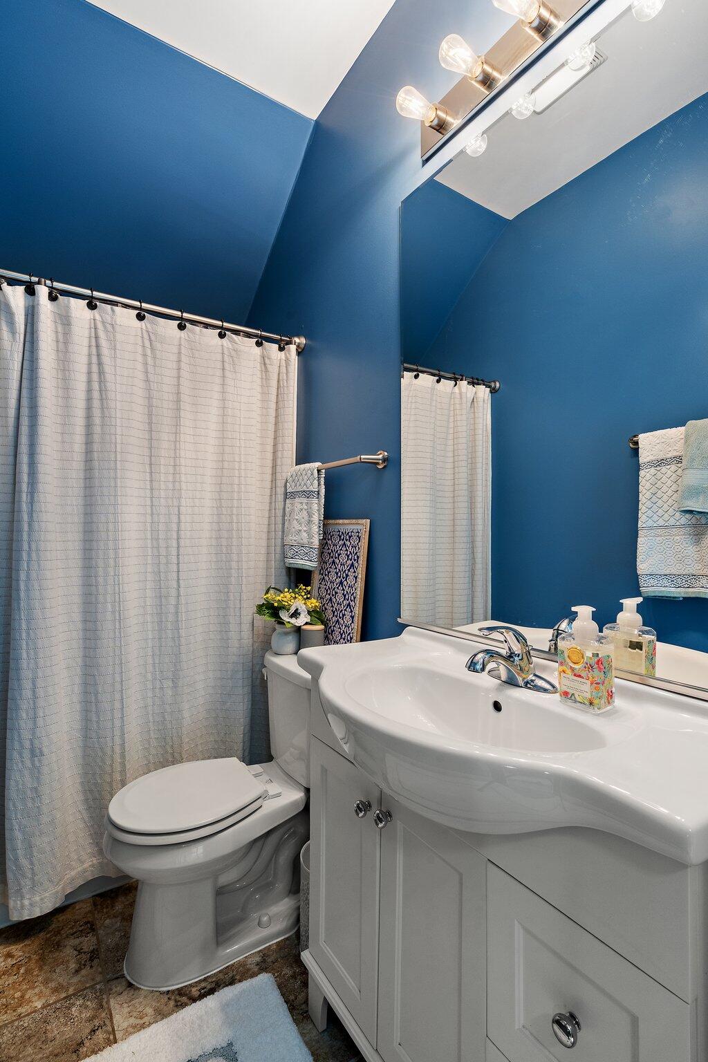 105 Madison Street Valparaiso, IN 46385 - Photo 12 of 29 a bathroom with a sink a toilet and shower