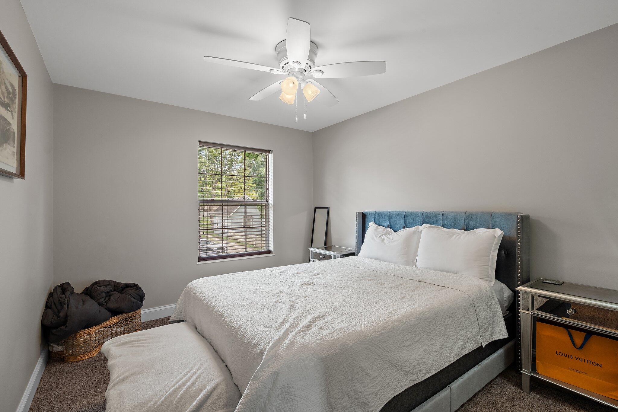 105 Madison Street Valparaiso, IN 46385 - Photo 21 of 29 a bedroom with a bed and window