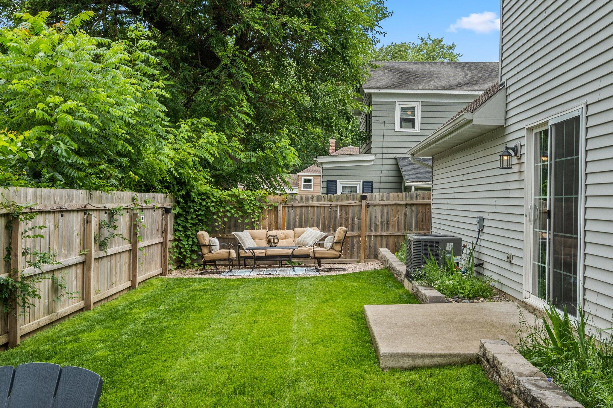 105 Madison Street Valparaiso, IN 46385 - Photo 24 of 29 a view of a house with backyard sitting area and garden