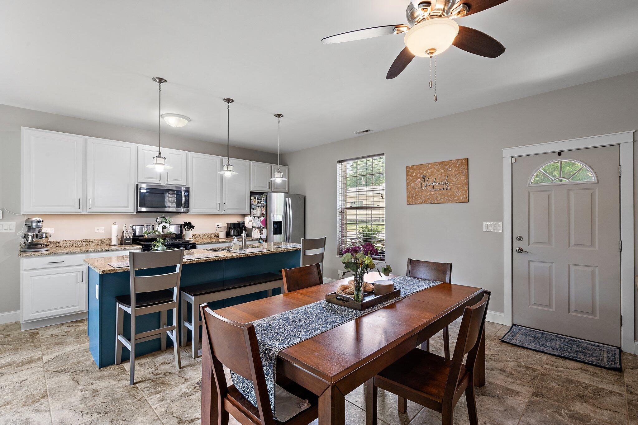 105 Madison Street Valparaiso, IN 46385 - Photo 5 of 29 a kitchen with a dining table and chairs