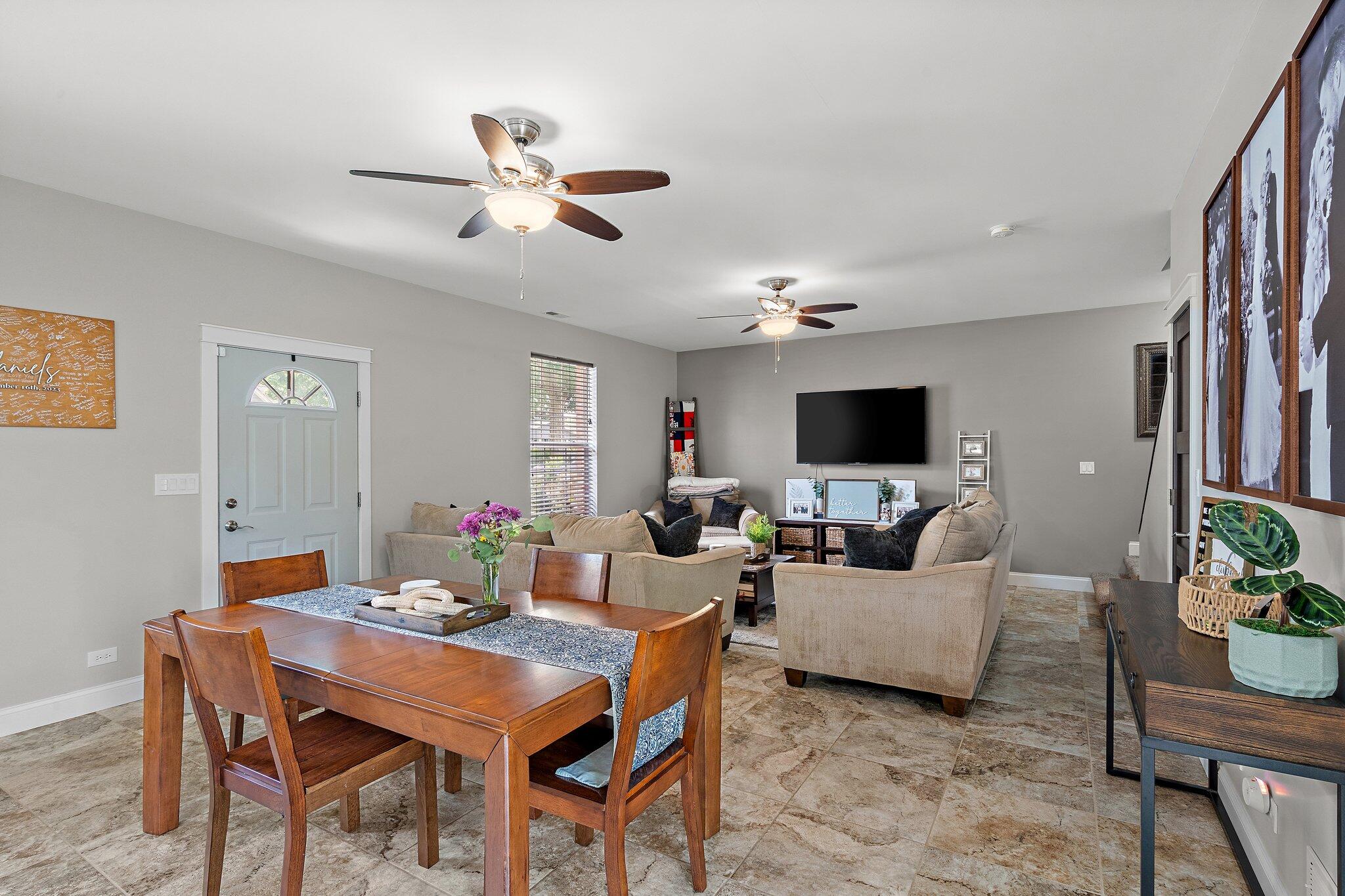 105 Madison Street Valparaiso, IN 46385 - Photo 6 of 29 a living room with furniture a chandelier and a flat screen tv
