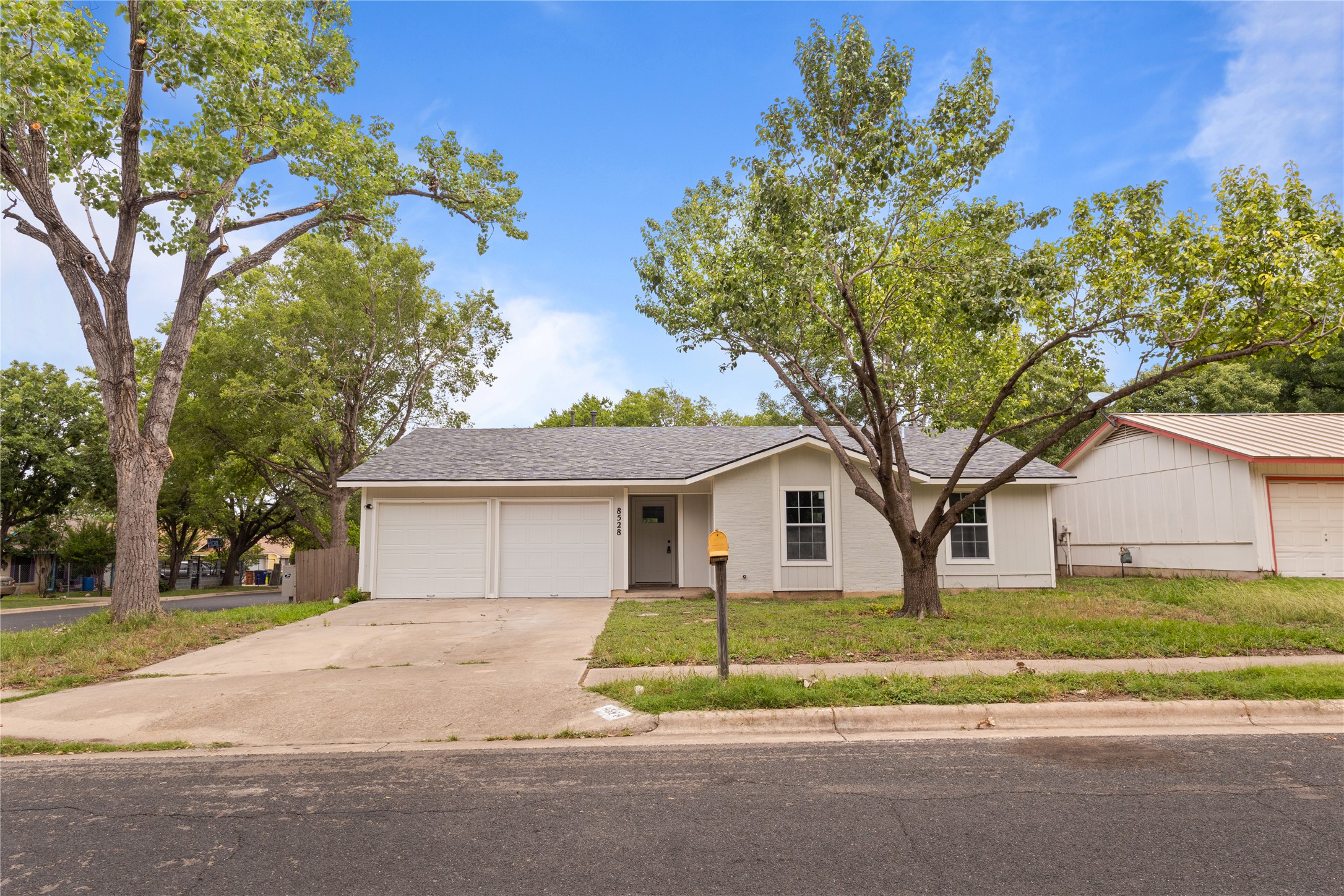 8528 Cornwall Drive Austin, TX 78748 - Photo 1 of 24 View of front of home featuring a garage, driveway, and a front lawn