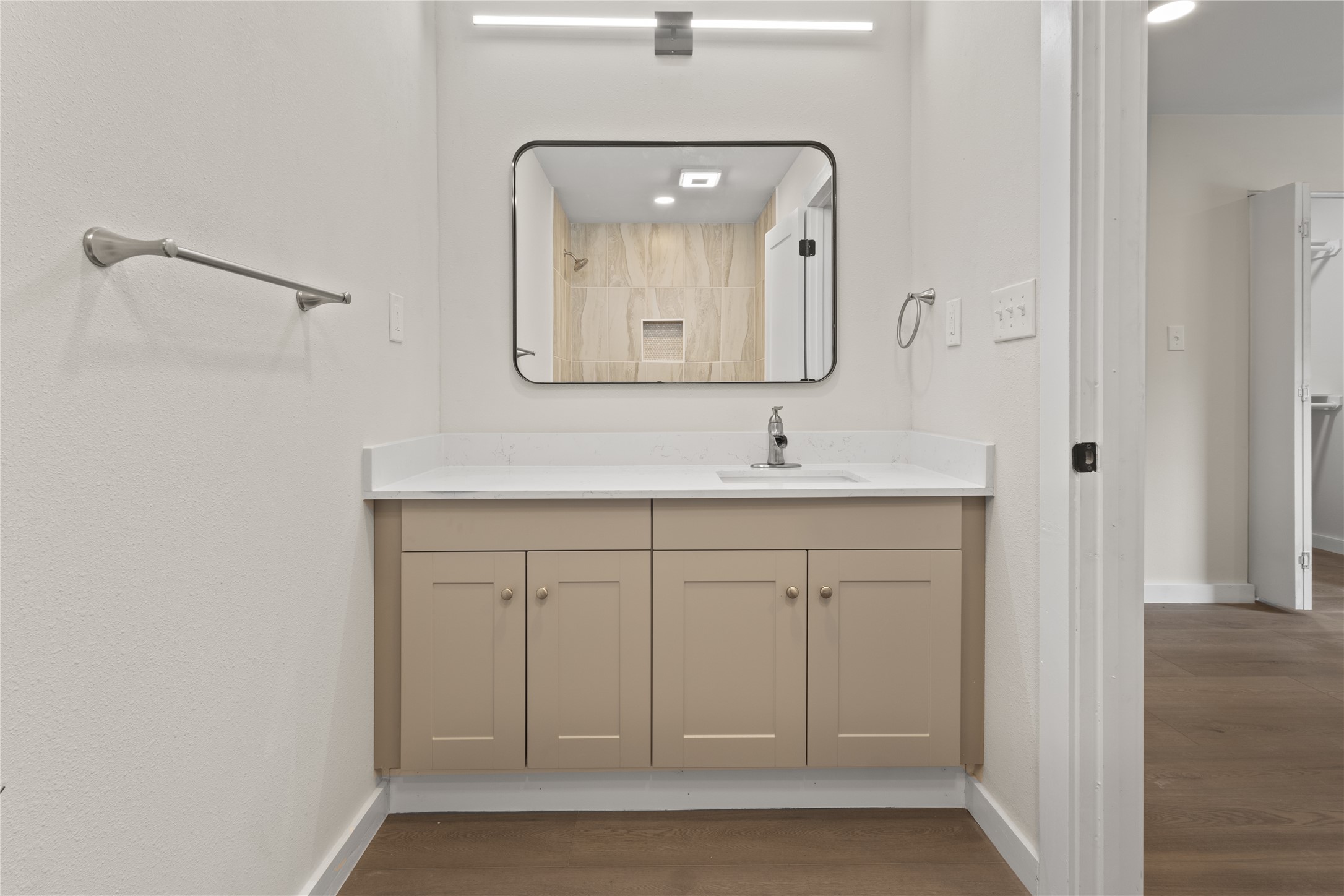 8528 Cornwall Drive Austin, TX 78748 - Photo 21 of 24 Full bath featuring baseboards, vanity, and wood finished floors