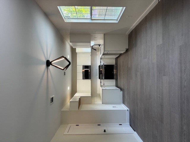 8528 Cornwall Drive Austin, TX 78748 - Photo 6 of 24 Kitchen with stove, a sink, baseboards, dark wood-style floors, and light countertops