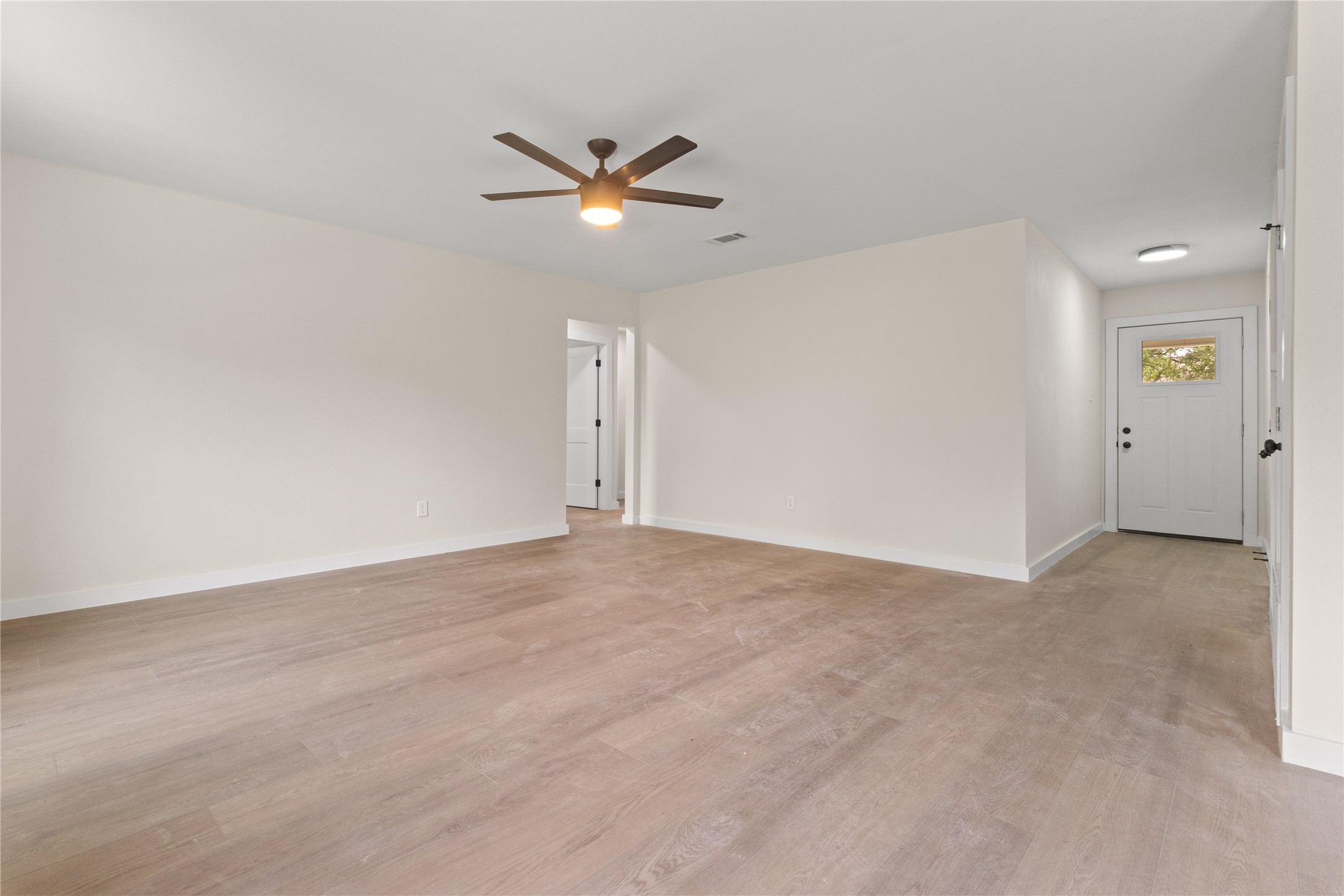 8528 Cornwall Drive Austin, TX 78748 - Photo 9 of 24 Spare room featuring light wood finished floors, ceiling fan, and baseboards
