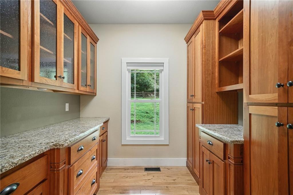 87 Dillons Lane Morganton, GA 30560 - Photo 11 of 42 a kitchen with granite countertop cabinets and window
