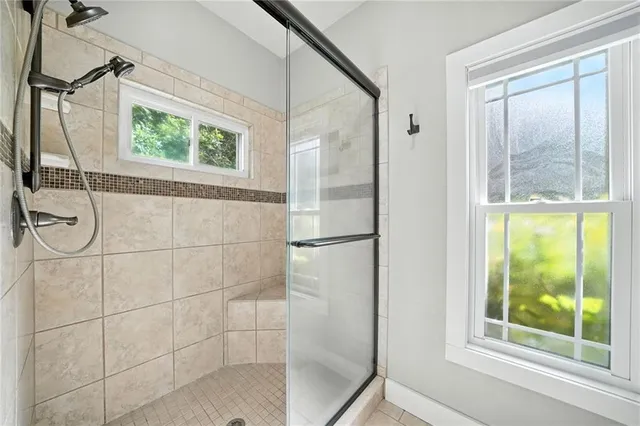 a bathroom with a glass shower door