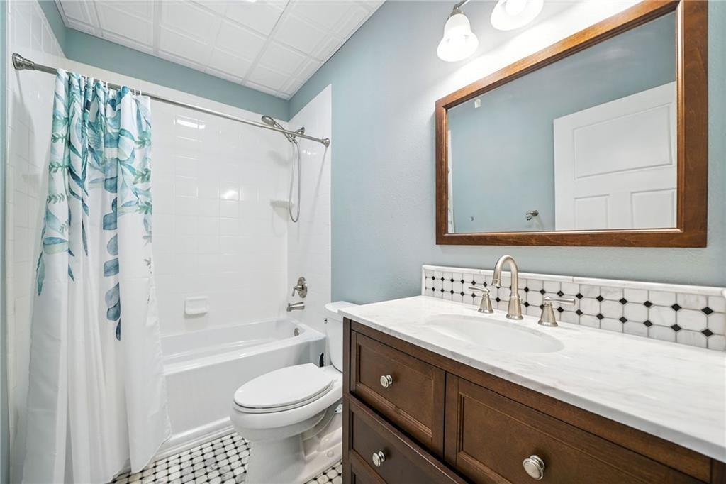 87 Dillons Lane Morganton, GA 30560 - Photo 21 of 44 a bathroom with a sink a toilet and a bathtub