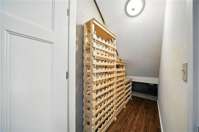 a view of a door and wooden floor