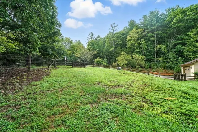 a backyard of a house with lots of green space