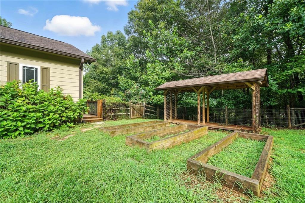 87 Dillons Lane Morganton, GA 30560 - Photo 36 of 44 a view of a house with a yard and sitting area