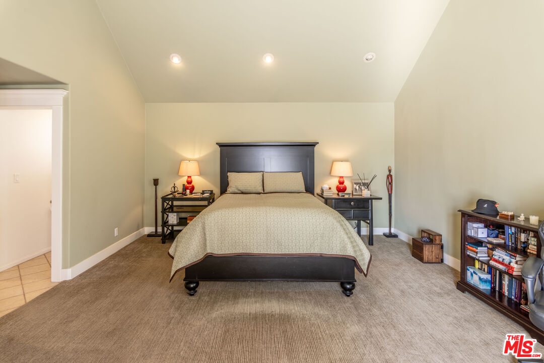 880 Wellesley Avenue Los Angeles, CA 90049 - Photo 16 of 29 a bedroom with a bed and a window