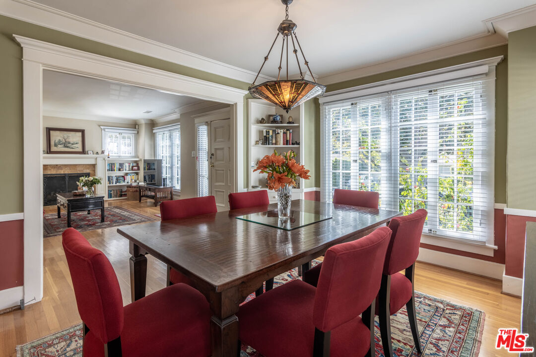 880 Wellesley Avenue Los Angeles, CA 90049 - Photo 10 of 29 a view of a dining room with furniture window and wooden floor