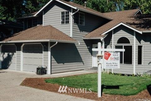 7109 Lower Ridge Road Everett, WA 98203 - Photo 22 of 22 a front view of a house with a yard