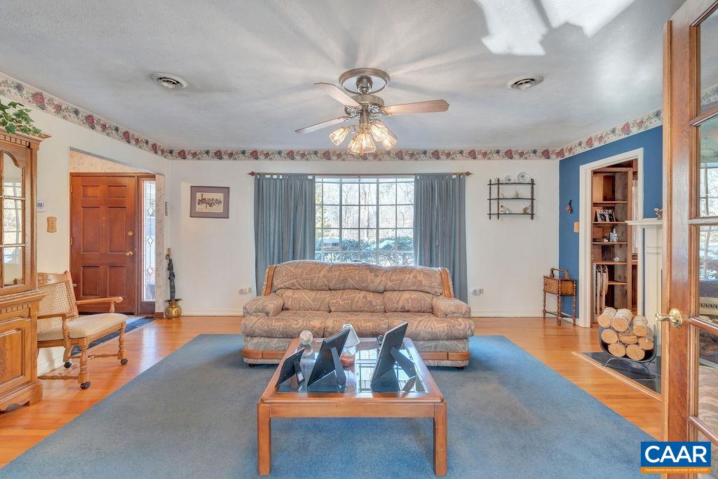 3721 Ivy Road Charlottesville, VA 22903 - Photo 5 of 75 a living room with furniture and a chandelier