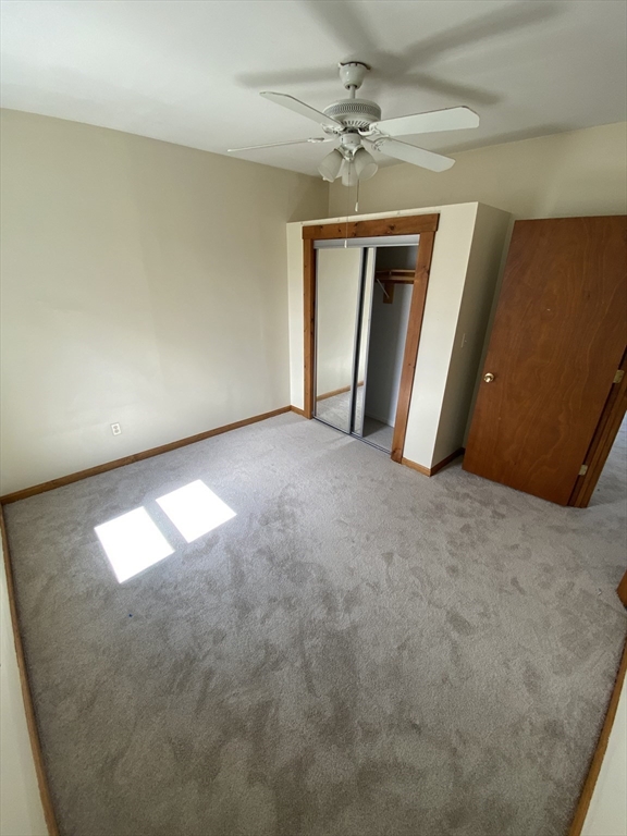 10 Lafayette Street, Unit 2 Attleboro, MA 02703 - Photo 3 of 9 a view of an empty room with a window