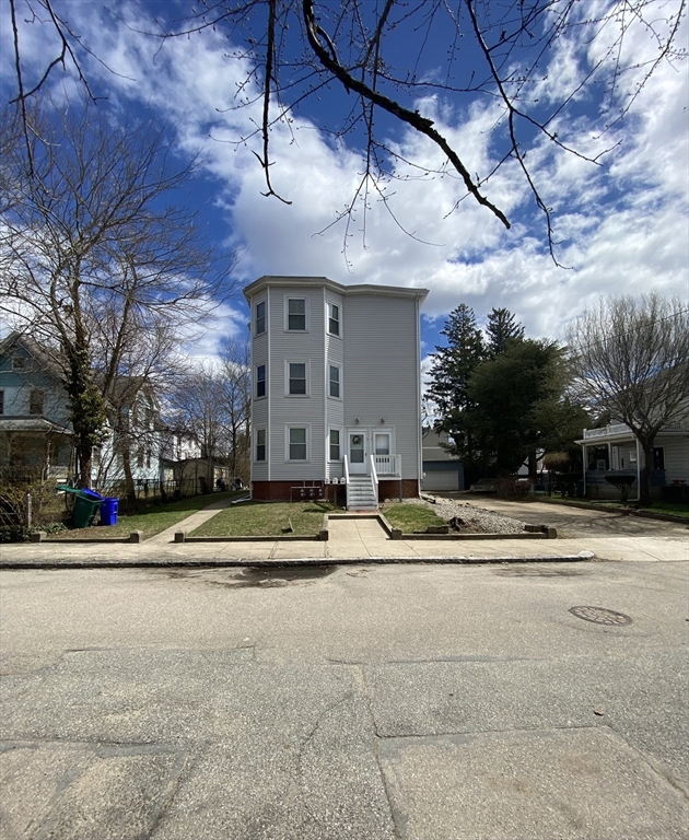 10 Lafayette Street, Unit 2 Attleboro, MA 02703 - Photo 8 of 9 a view of a white building with a street