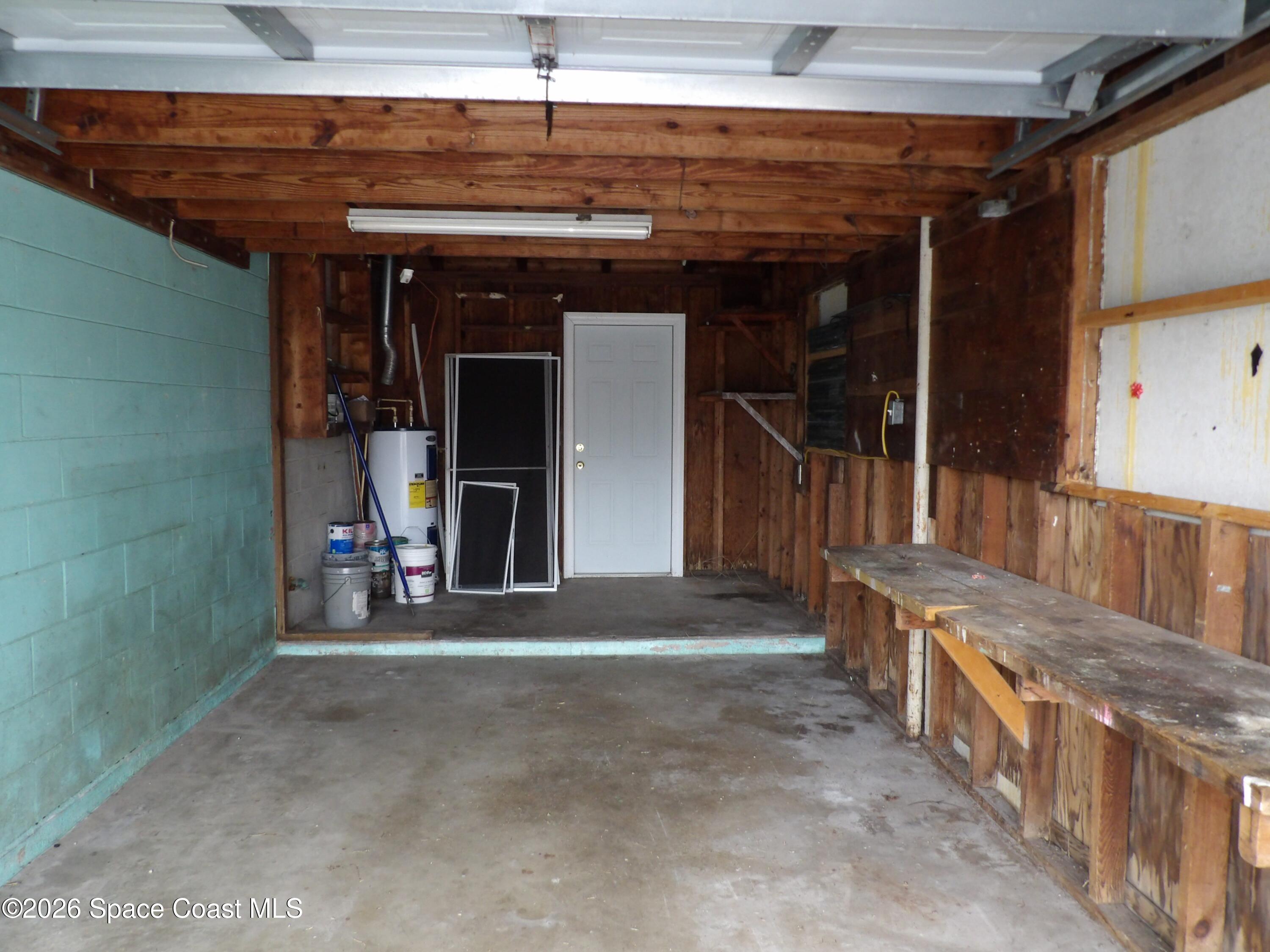 2107 Little John Road Melbourne, FL 32935 - Photo 12 of 13 a view of a room with wooden walls