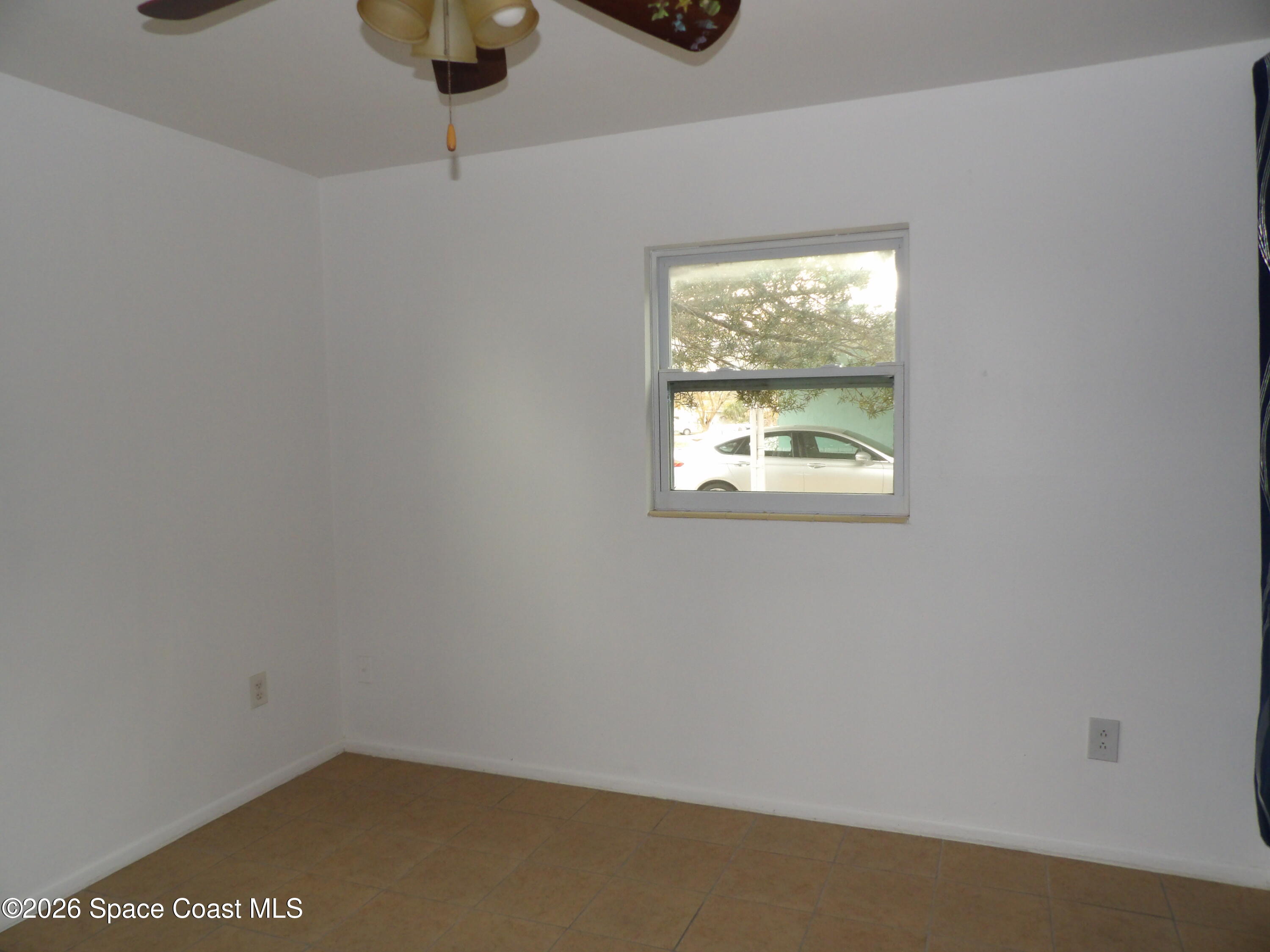 2107 Little John Road Melbourne, FL 32935 - Photo 8 of 13 a small space with a window