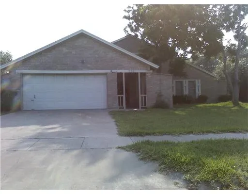a front view of house with garage and yard