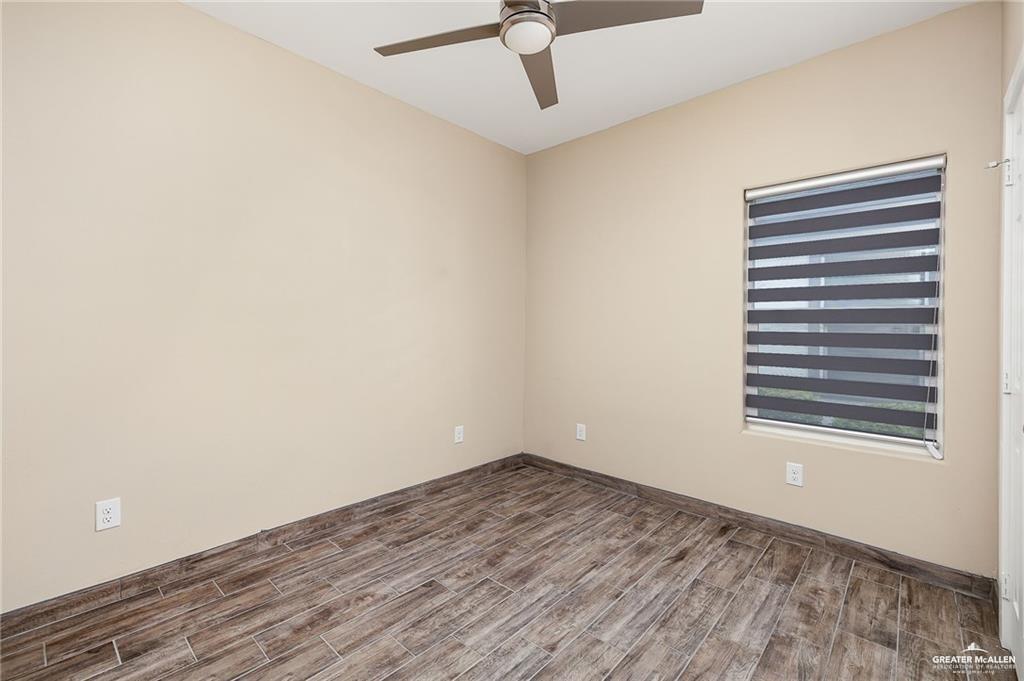 1809 Ramirez Street, Unit 2 Mission, TX 78573 - Photo 11 of 11 a view of empty room with wooden floor and fan