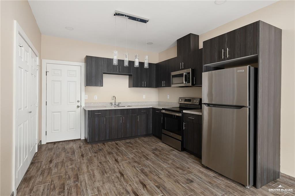 1809 Ramirez Street, Unit 2 Mission, TX 78573 - Photo 6 of 11 a kitchen with stainless steel appliances a refrigerator and a sink