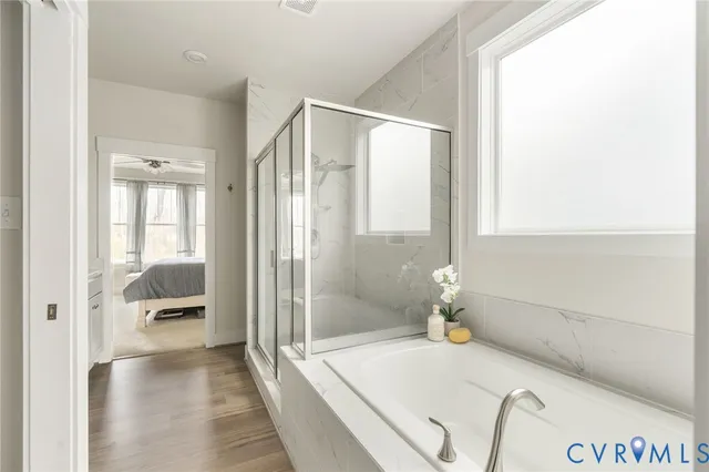 a bathroom with a shower and a tub