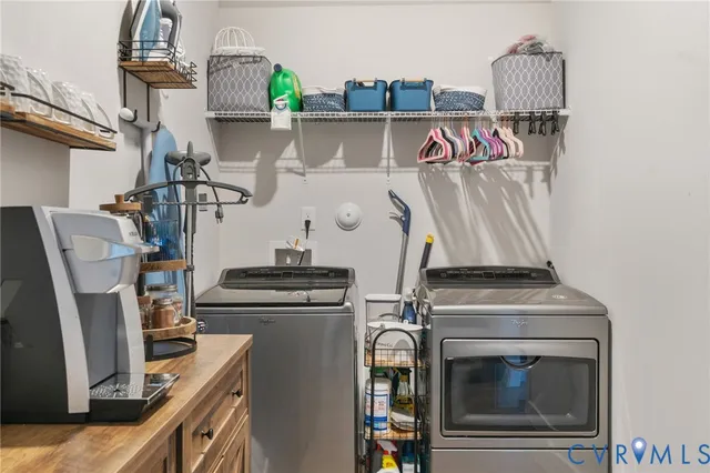 a view of storage and utility room with washer and dryer