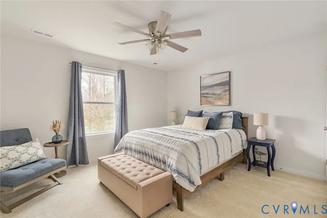 a bedroom with a bed and a couch