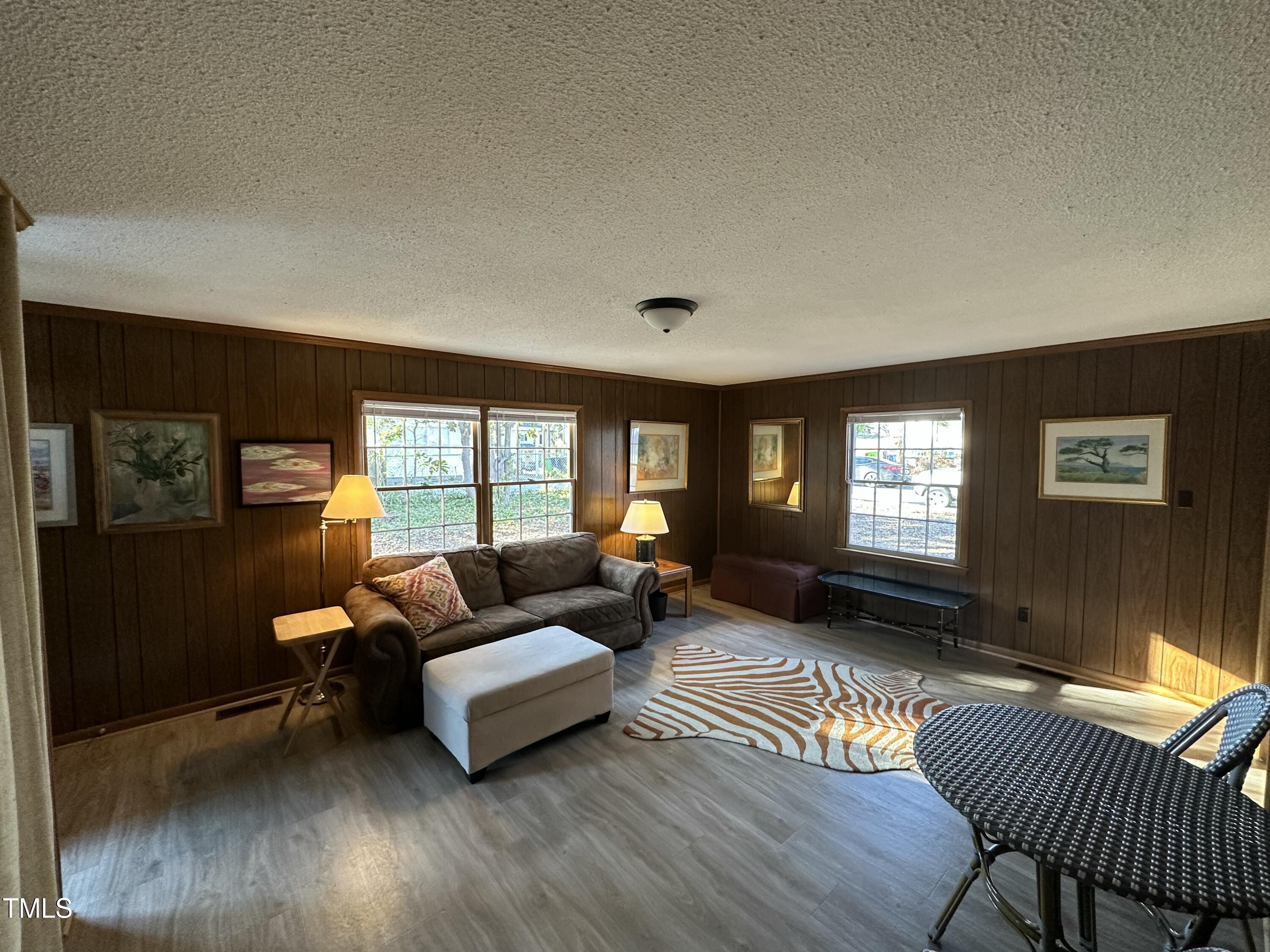 1304 East Jones Street Raleigh, NC 27610 - Photo 11 of 12 a living room with furniture and a window