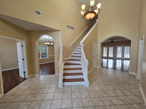 a view of entryway and hall with a front door