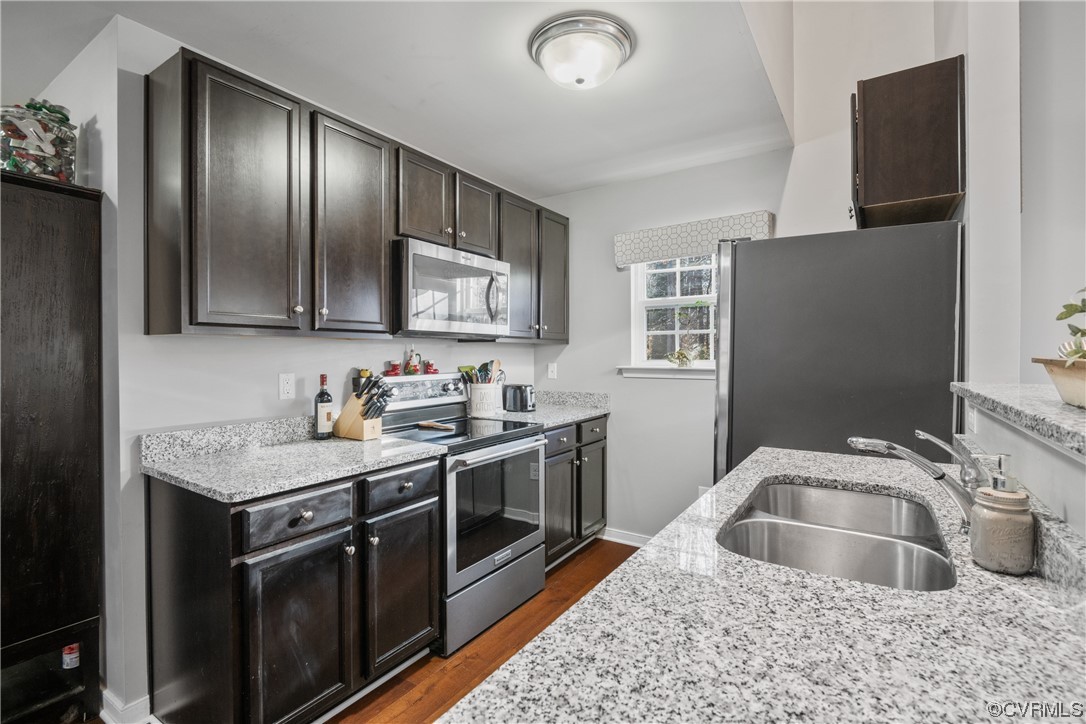 1700 Hybla Road North Chesterfield, VA 23236 - Photo 11 of 37 a kitchen with stainless steel appliances granite countertop a sink stove and refrigerator