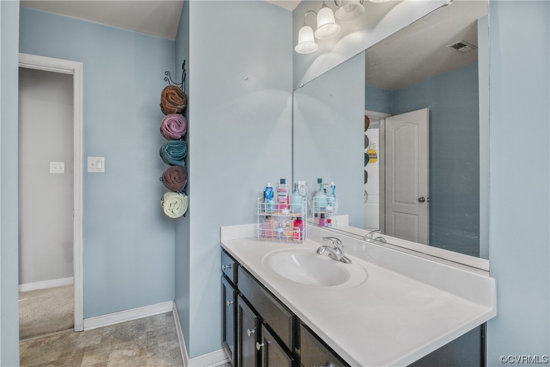 1700 Hybla Road North Chesterfield, VA 23236 - Photo 28 of 37 a bathroom with a sink and a mirror