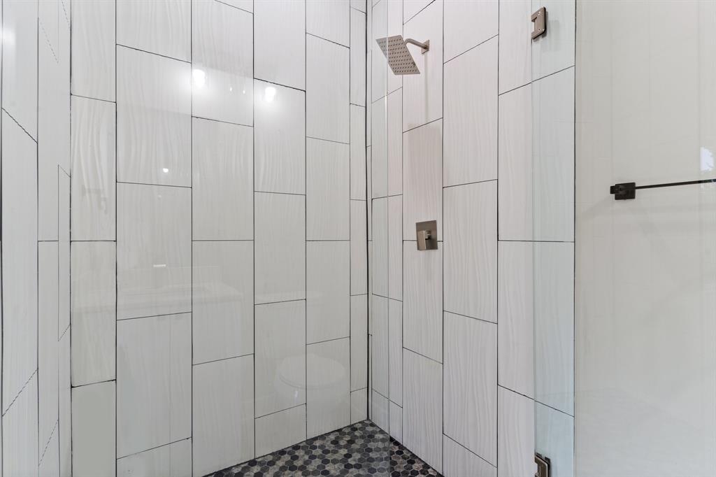 5810 Hudson Street, Unit 105 Dallas, TX 75206 - Photo 22 of 33 a bathroom with a shower