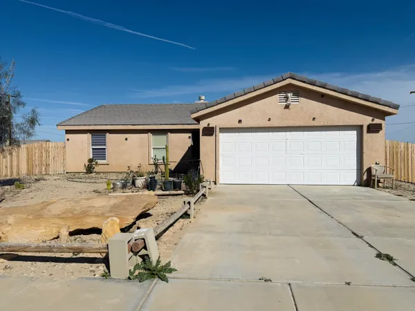 a front view of a house with yard