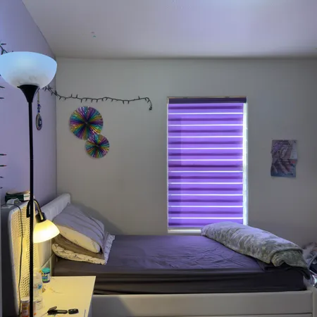 a room with mirror and cabinets