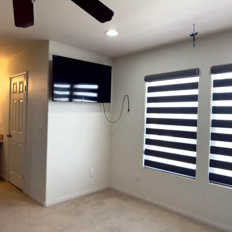 a bathroom with a granite countertop sink and a toilet
