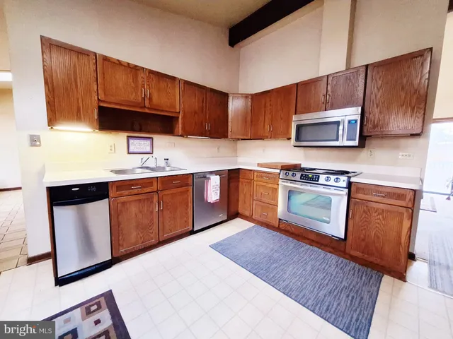 a very nice looking room with a large window and furniture