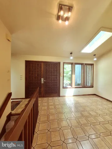 a kitchen with stainless steel appliances a sink and a refrigerator