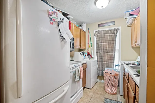 a kitchen with appliances cabinets and a counter top space
