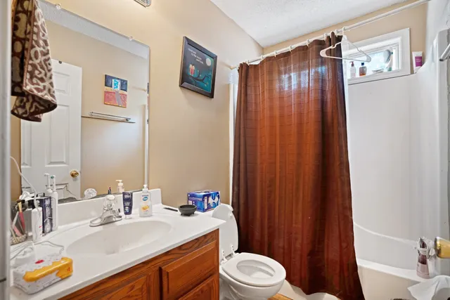 a bedroom with two bed and a closet