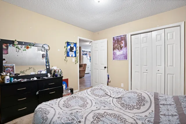 a view of a door and chair in the back yard of the house