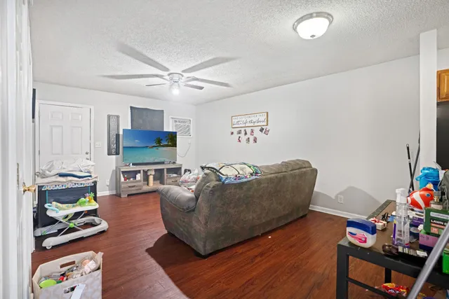 a kitchen with a refrigerator and a stove