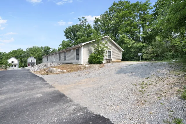 a view of a house with a street
